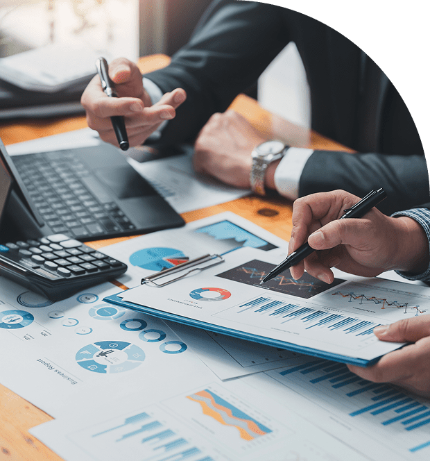 Business meeting with charts and laptop.