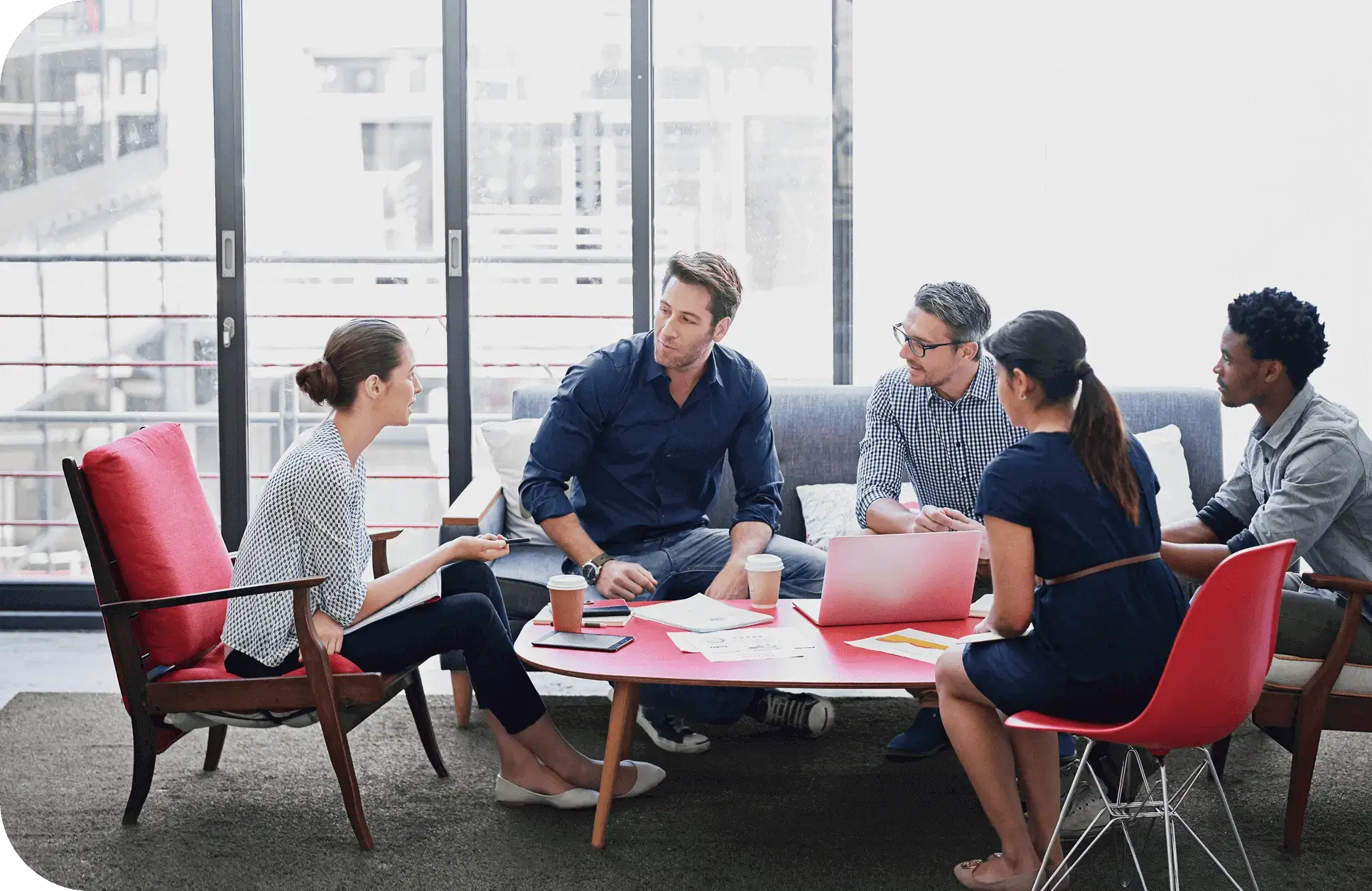 Group discussion in modern office setting.